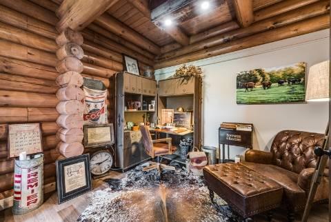 home office in log home with exposed large log walls